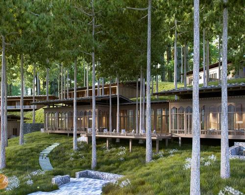 The lodge is set in a pine forest on a hillside above a stream