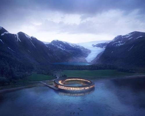 The glass-fronted, circular property will float on stilts above the Holandsfjorden fjord and is scheduled to open in late 2022