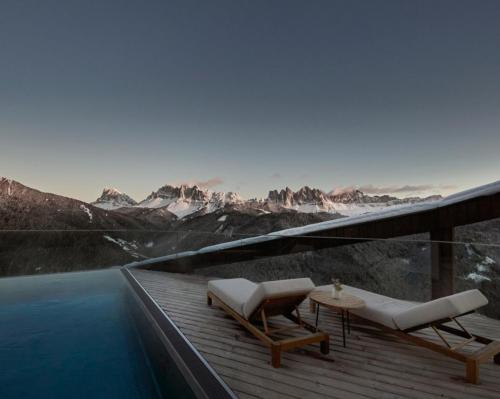 The wellness retreat is set against the backdrop of the breathtaking UNESCO World Natural Heritage Dolomites