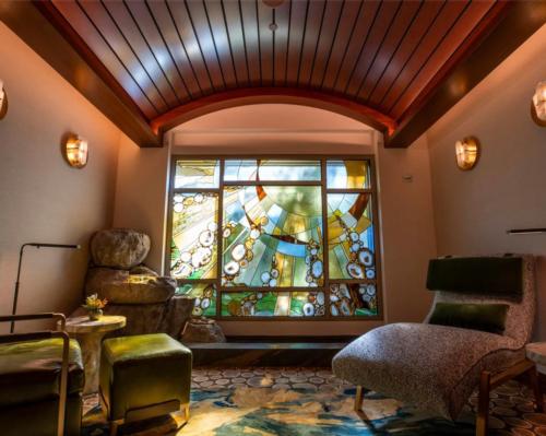 Within the spa, guests will discover a Tenaya Stone, a focal point and a place to pause and set intentions which leads to a sunlit relaxation room with a stained-glass window of a rising sun and a trickling water feature