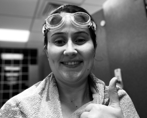 Sponsored swimmer supporting friend in need