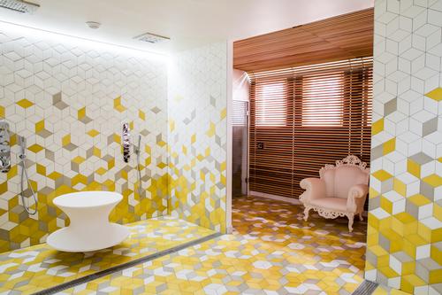 Le Spa L’Occitane uses a palette of yellow, brown and white
