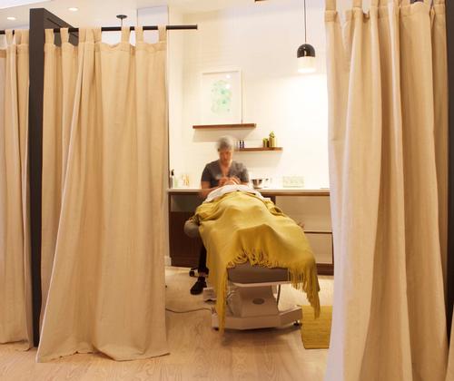 Heyday has eight open-plan, semi-private treatment spaces, where clients have partitions beside them and partial curtains in front of them