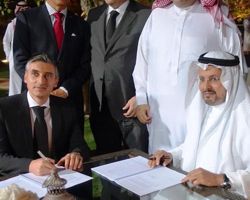 Rui Urbano, partner at Vivafit (sitting, left) signing the deal with Ithraa CEO Eid Al Shamri (sitting, right)