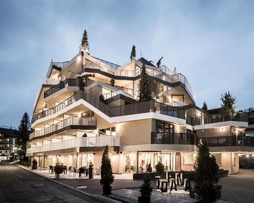 The irregular, asymmetrical silhouette of the Hotel Tofana is designed to evoke a tree-lined mountain peak