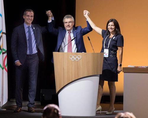 IOC president Thomas Bach (centre) with Paris mayor Anne Hidalgo (right) and LA mayor Eric Garcetti (left)