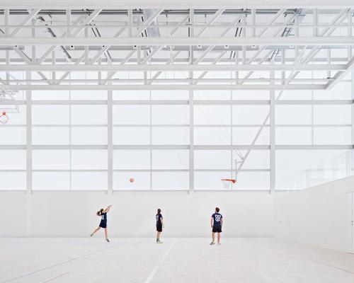 Spanish architect Alberto Campo Baeza has completed a minimalist semi-transparent sports hall for a university in Madrid
