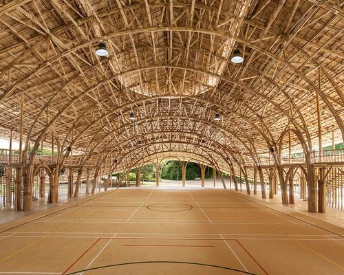 Thai studio create bold bamboo sports hall for Chiang Mai school 