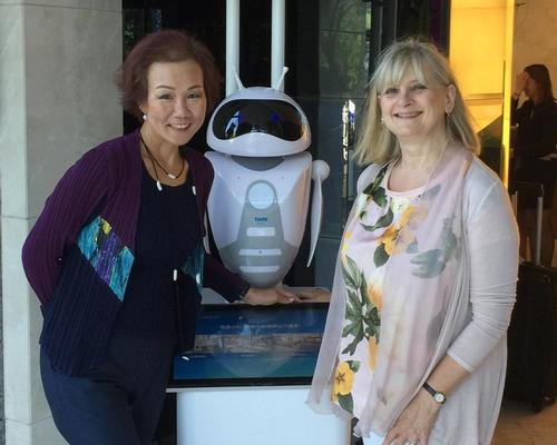 Dorsett Shanghai's customer service robot, pictured with general manager Doris Hui (left) and journalist Lucy Daltroff (right), will become part of the hotel staff for the next two years