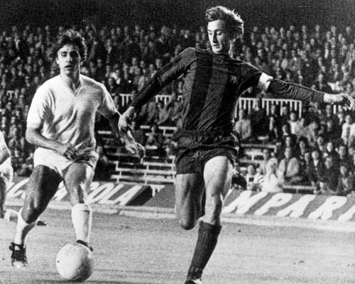 Johan Cruyff, shown here scoring for Barcelona against Lazio in 1975, revolutionised coaching using Total Football principles