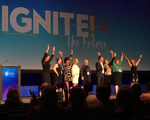 Members of the ISPA board and ISPA Foundation chair Frank PItsikalis celebrate the theme of this year's event, 'Ignite the Future.' 