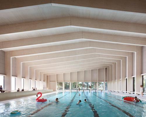 HawkinsBrown complete timber pool facility for 'swimming among the trees'
