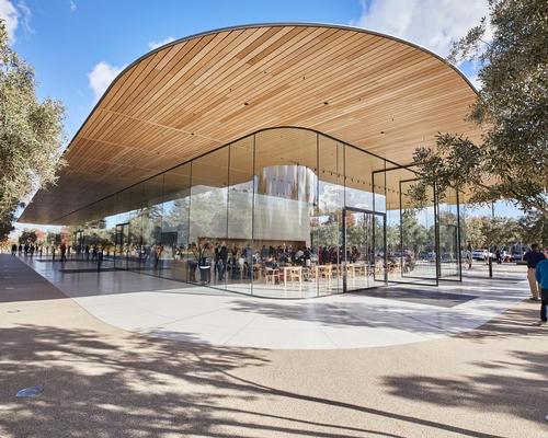 The building is formed of a transparent envelope situated below a cantilevering carbon-fibre roof, which hosts an expansive terrace offering a panoramic view of Apple Park
