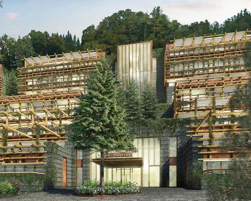 The Waldhotel is located in a forested area of natural beauty and designed to be gradually enveloped by the surrounding greenery to embrace the concept of forest bathing