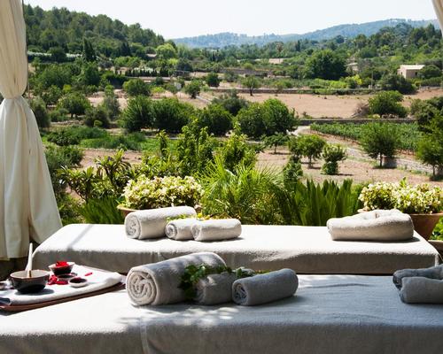 The spa is set in a garden surrounded by local flowers and herbs, and includes treatment rooms that overlook the countryside and hills of northern Mallorca