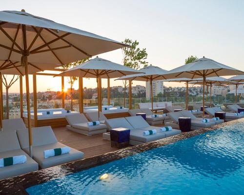 A rooftop pool and bar overlooks Jerusalem