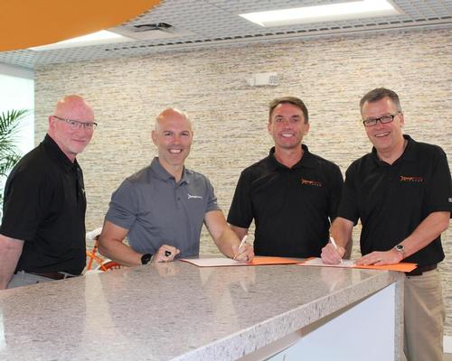 Dave Carney, president Orangetheory (left), with Orangetheory CEO Dave Long (second left) with Mike Dixon, chair of Wellcomm Health & Fitness (second right) and Alistair Firth, CEO of Wellcomm Health & Fitness (right) 