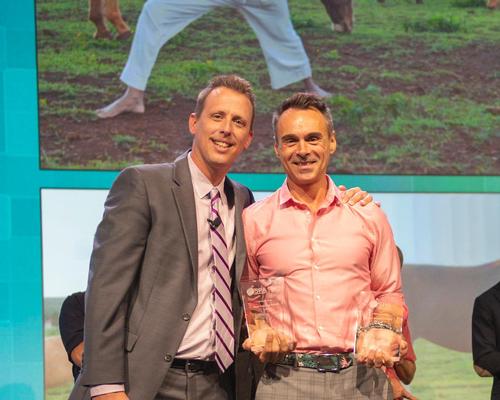 Shaw Cote, spa director at Four Seasons Resort Lana’i, accepts the award on stage with ISPA chair Garrett Mersberger