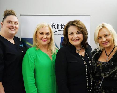 Lydia Sarfati (second from right) joined faculty members and students from Bellus Academy's aesthetics department to launch CIDESCO USA's first qualification