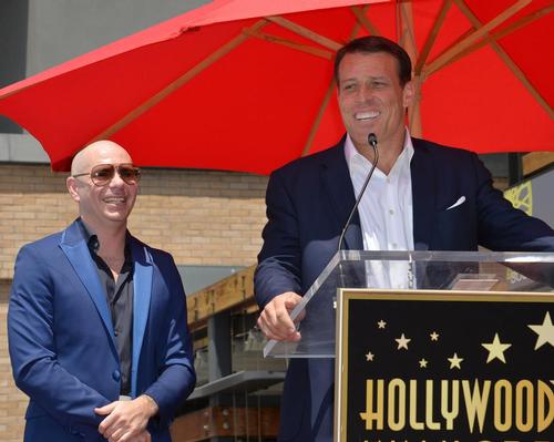 Tony Robbins (right) rapper Pitbull (left) will open the first Grit Bxng studio in June