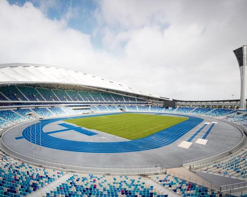 gmp Architekten design stadium with translucent roof on China's largest tropical island