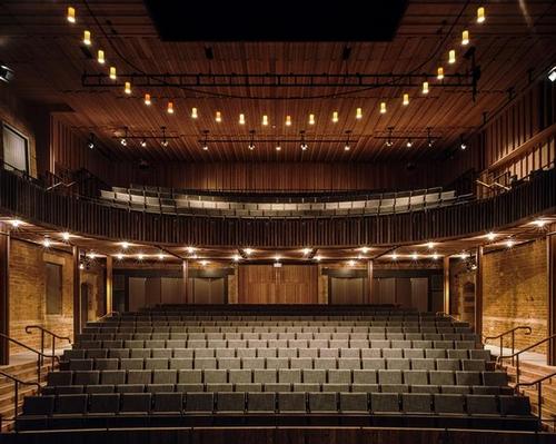 Neville Holt Opera: Witherford Watson Mann Architects have created the theatre in board marked concrete, held away from the stable block walls by a compacted hoggin edge