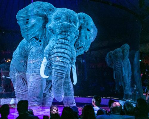 Holographic elephants perform a number of stunts in the show