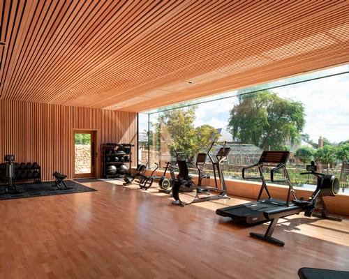 One of world's largest glass panels provides workouts with a view in Invisible Studio-designed gym