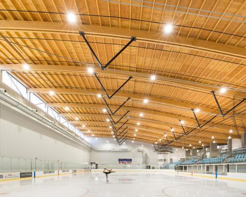 Francl Architecture ice sports centre features vast wave-like timber roof