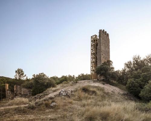 Carles Enrich Studio's timber scaffolding reactivates 13th-century lookout tower