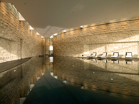 The curved stone walls by the pool make you feel as if you’re in the heart of a Swiss gorge