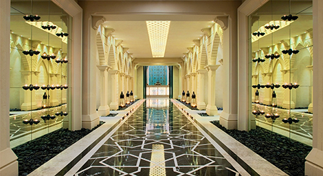 The entrance to the stunning spa – a regal corridor leading to a reception area with huge wooden doors – is truly dramatic 