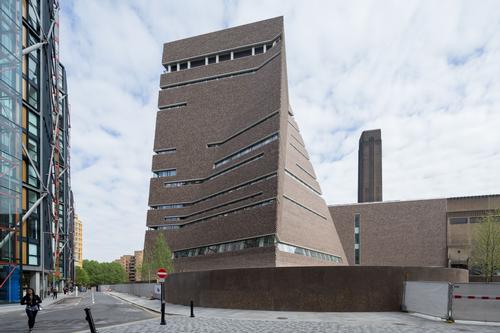 The new Tate Modern features a bold, pyramid-like extension called the Switch House, created by Herzog and de Meuron / Iwan Baan