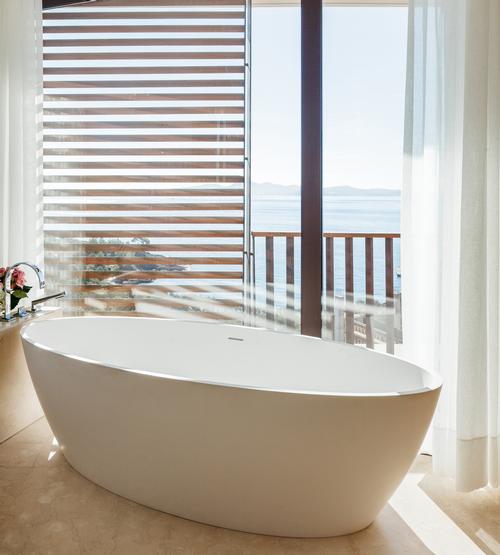 Each of the resort's 141 bedrooms offers views of the Aegean Sea