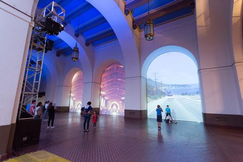 A series of giant projection screens were also installed within the archways of the arcade leading to the plaza / David Green