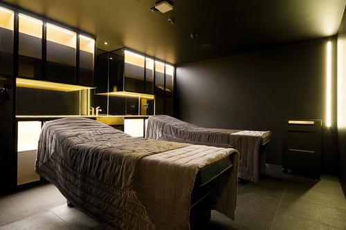 The spa’s black walls and gold accents provide a backdrop for signature treatments, such as the Diamonds Don’t Lie Facial by Gemology