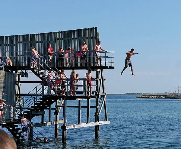 People jumping in the harbour People jumping in the harbour