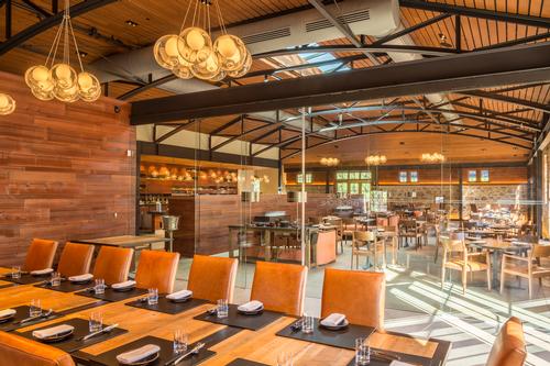 The original stonework dating from 1886 is highlighted by custom-designed steel features, including exposed steel trusses with gracefully arched undersides / Jay Graham