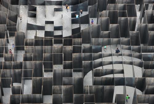 The labyrinth stands at 37.5 metres (123 foot) at its highest points and is comprised of 5mm thick steel plates / Filip Dujardin