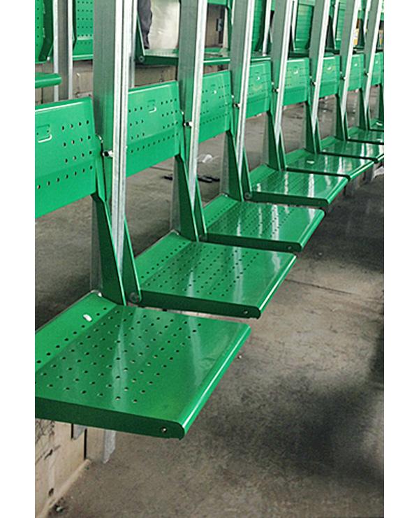 Rail seating features folding seats within a metal frame that separates the rows
