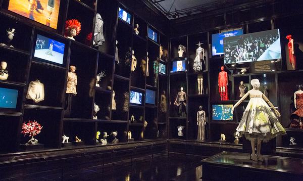 A dress in the Cabinet of Curiosities gallery at the V&A was famously spray-painted by robots as part of Alexander McQueen’s S/S collection in 2013 (left) / PHOTO: Victoria and Albert Museum, London
