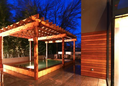 SoJo Spa Club features a number of specialty outdoor soaking experiences including hinoki wood (pictured), carbon-rich and silk baths