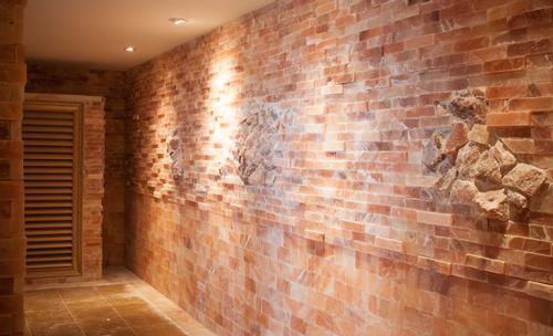 The pink salt bricks in the salt sauna at SoJo Spa Club traveled more than 7,400 miles from the Himalayas