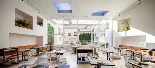 Indoor plants and green walls feature within the restaurant in an attempt to 'bring the outside in'