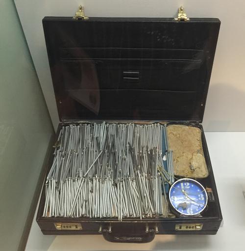 A unique collection of items, including this undetonated nail bomb are on display