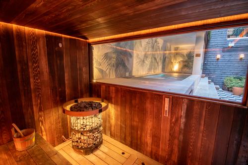 A sauna looks out over the relaxation pool / Jason Ennis – Press Up Entertainment Group