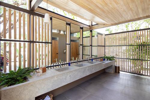 Changing areas use pale materials and are filled with natural light