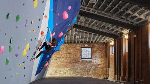 Brickwork in the warehouse was left exposed to contrast with the climbing walls / Andrew Conroy