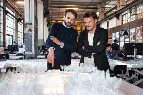 Jan Christian Vestre, CEO of Vestre (left) and Bjarke Ingels viewing a model of The Plus / Vestre/Bjarke Ingles Group