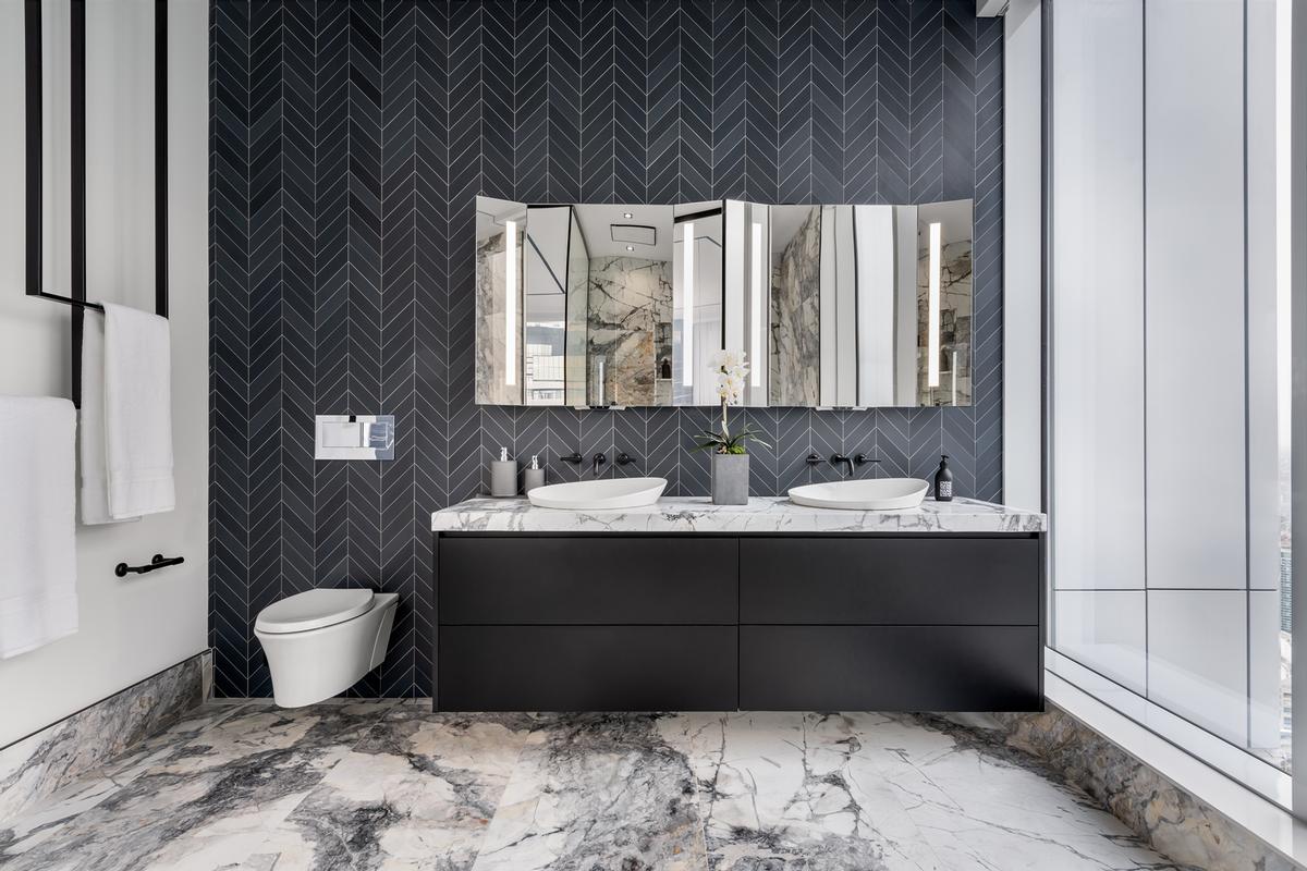 The ensuite bathroom with heated floors, a smart mirror and an AV-connected vibracoustic bath